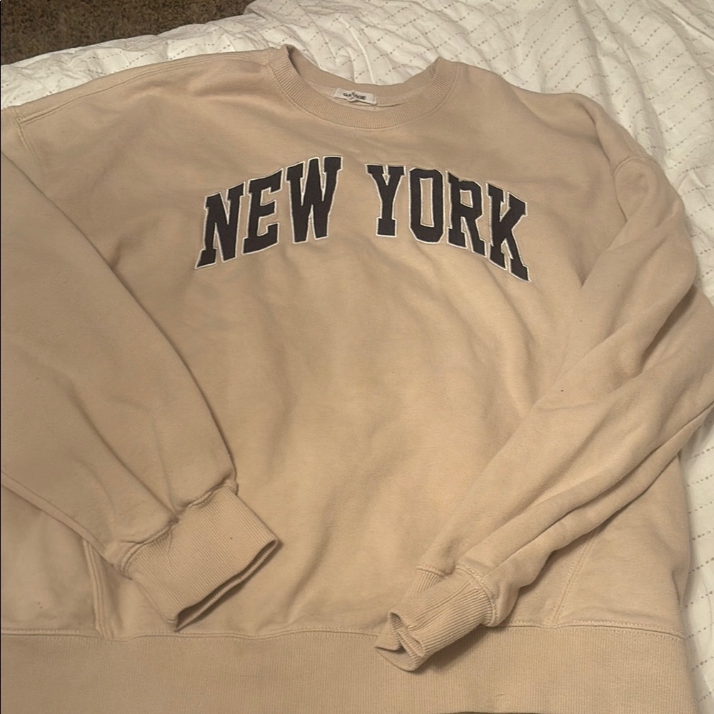 garage tan crewneck with navy blue letters